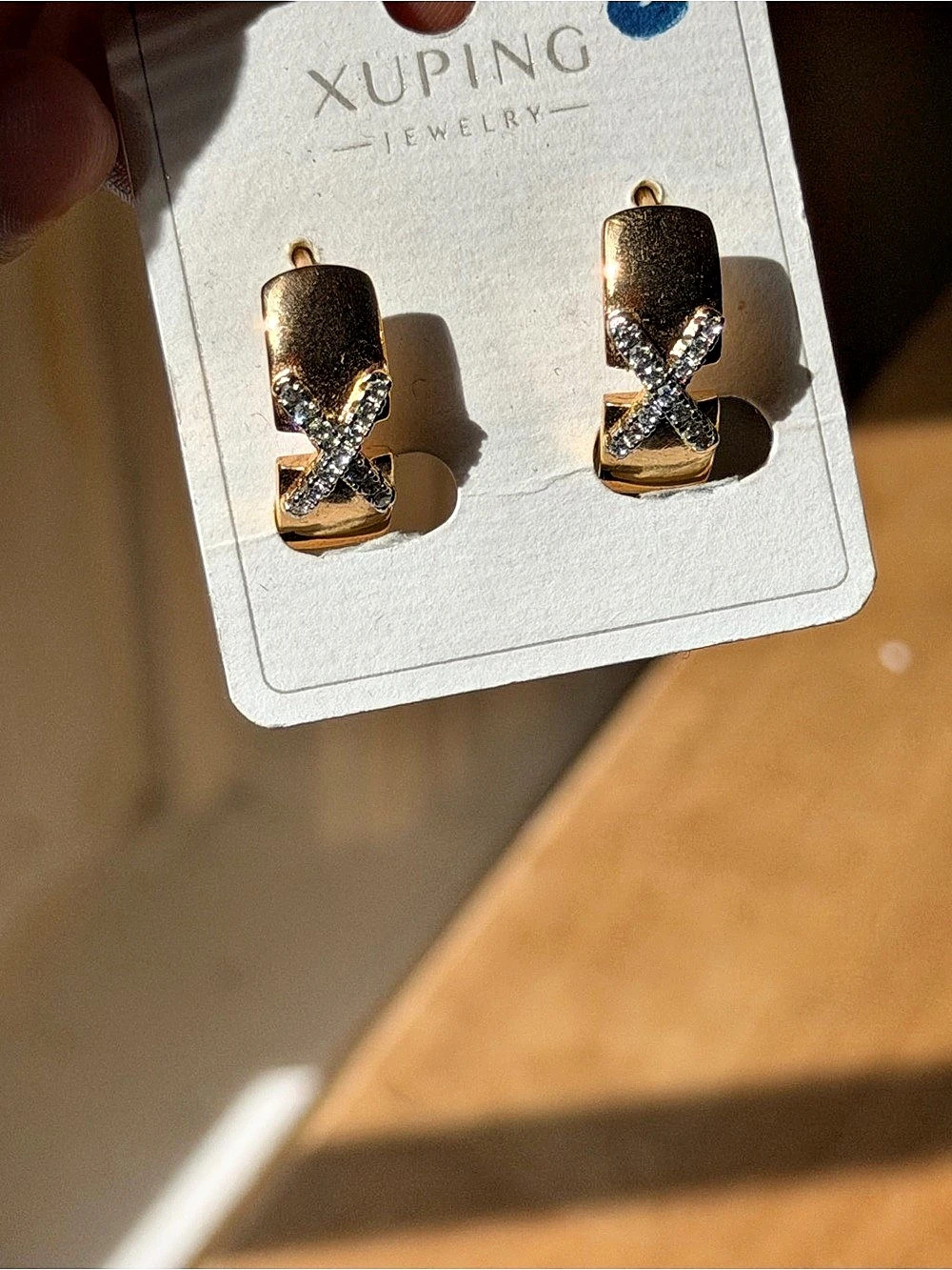 Gold Tone Crystal X Hoop Earrings